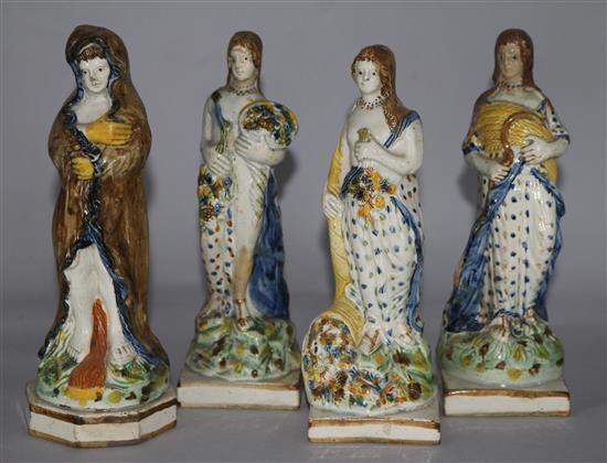 A set of three Prattware glazed pottery figures, c.1790-1800, representing the seasons and a Prattware figure of Winter, 8in.